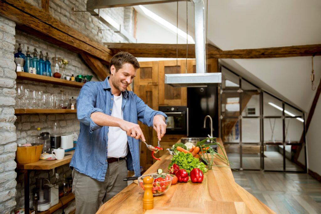 Young man preparing food in the kitchen